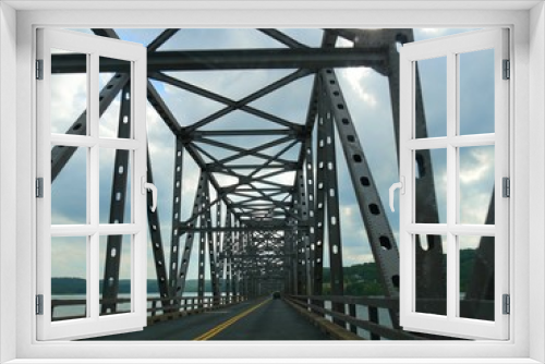 Fototapeta Naklejka Na Ścianę Okno 3D - A close up of a covered steel bridge over Table Rock Lake, Missouri