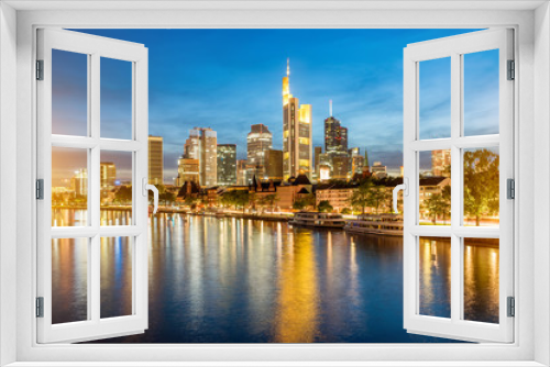 Fototapeta Naklejka Na Ścianę Okno 3D - Beautiful panoramic cityscape view with illuminated skyscrapers during the twilight in Frankfurt, Germany