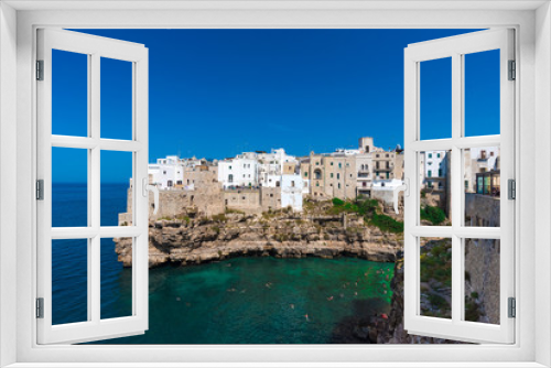 Fototapeta Naklejka Na Ścianę Okno 3D - Polignano a Mare (Puglia, Italy) - The famous sea town in province of Bari, southern Italy. The village rises on rocky spur over the Adriatic Sea, and is known tourist attraction.