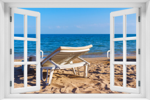 Fototapeta Naklejka Na Ścianę Okno 3D - White sunbed on the sand beach at the sea, summer sea rest concept