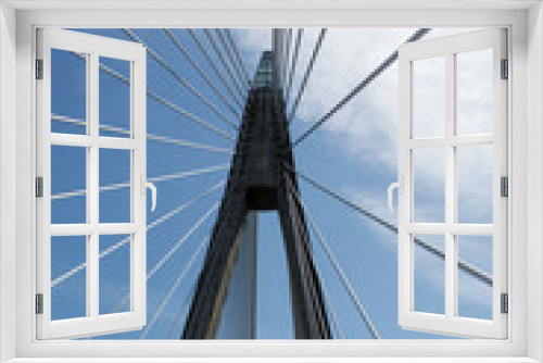 Fototapeta Naklejka Na Ścianę Okno 3D - Suspension bridge against blue and cloudy sky
