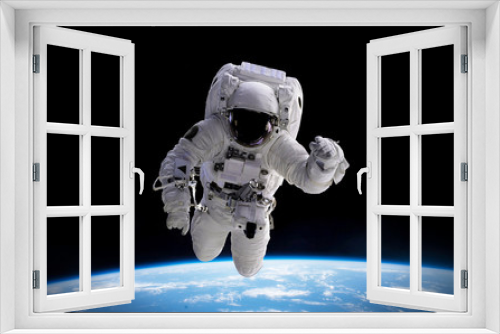 Fototapeta Naklejka Na Ścianę Okno 3D - astronaut in orbit of planet Earth