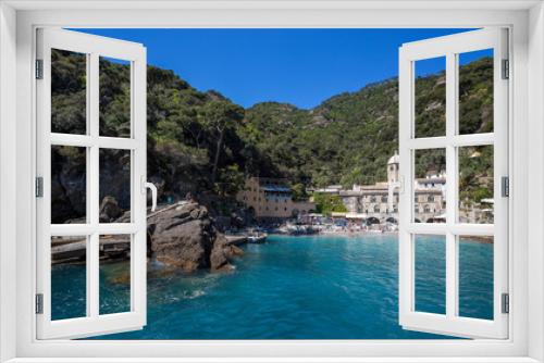 Fototapeta Naklejka Na Ścianę Okno 3D - SAN FRUTTUSO DI CAMOGLI, ITALY, MAY, 4, 2016 - San Fruttuoso di Camogli, Ligurian coast, Genoa province, with its ancient Abbaey, the beach and tourists.