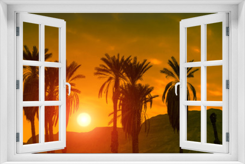 Fototapeta Naklejka Na Ścianę Okno 3D - Palm trees against mountain at sunset