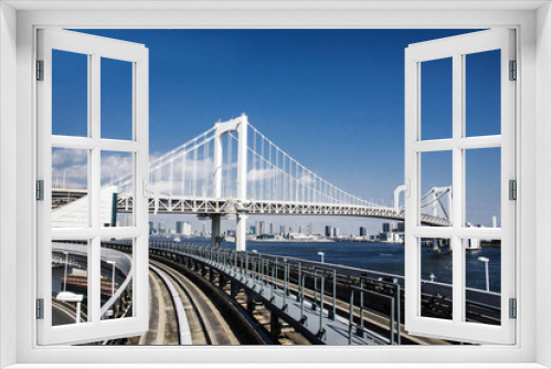 Fototapeta Naklejka Na Ścianę Okno 3D - Railway bridge construction in Tokyo with blue sky in the background. 