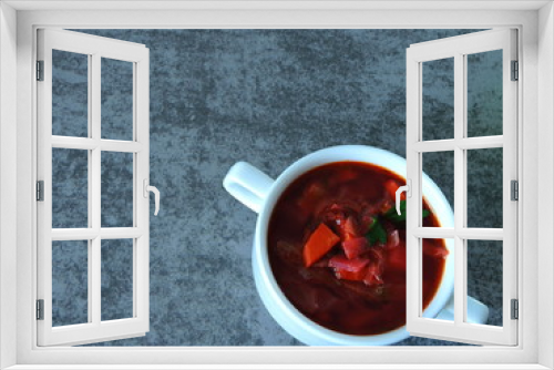 Fototapeta Naklejka Na Ścianę Okno 3D - Beautiful red soup in a white dish. Ukrainian red borsch. Authentic food. Slavic mood.