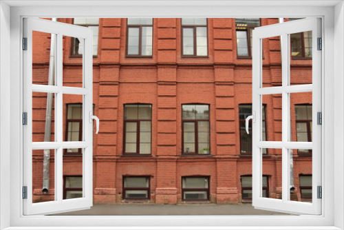 Fototapeta Naklejka Na Ścianę Okno 3D - Brick wall with windows and drainpipes
