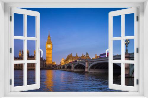 Fototapeta Naklejka Na Ścianę Okno 3D - London, England - The iconic Big Ben with Houses of Parliament and traditional red double decker bus on Westminster Bridge at sunrise with clear blue sky
