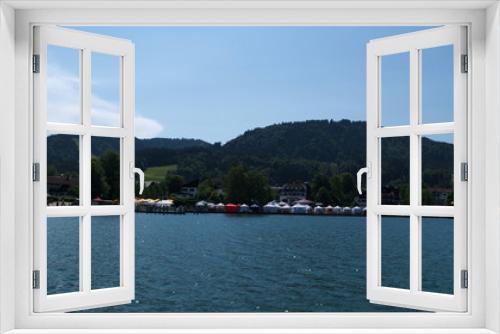 Fototapeta Naklejka Na Ścianę Okno 3D - Boating on the Tegernsee with a view over a Market at Bad Wiessee