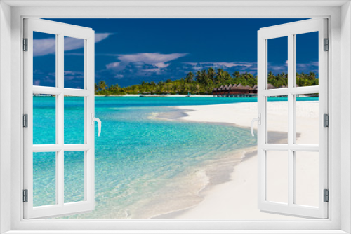 Fototapeta Naklejka Na Ścianę Okno 3D - Over water villas in Maldives and a white beach with palm trees