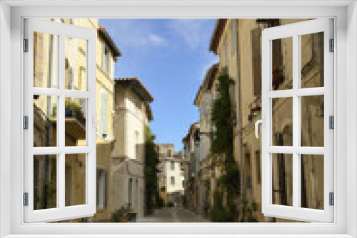 Fototapeta Naklejka Na Ścianę Okno 3D - Rue du centre-ville ancien d’Arles (13), France - Street in old downtown Arles, Provence, France 