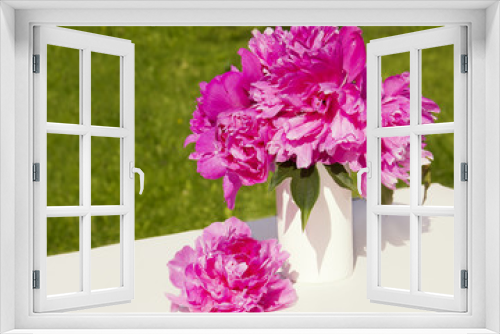 Fototapeta Naklejka Na Ścianę Okno 3D - A bouquet of pink peonies in a vase.