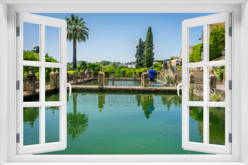 Fototapeta Naklejka Na Ścianę Okno 3D - Reflections on a pond at the Alcazar de los Reyes Cristianos castle in Cordoba, Spain, Europe