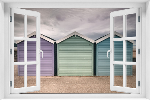 Fototapeta Naklejka Na Ścianę Okno 3D - Beach Huts Purple Green and Blue Grey Sky Weston Super Mare