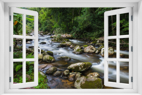 Fototapeta Naklejka Na Ścianę Okno 3D - Streams flow in natural rainforest in Laos.