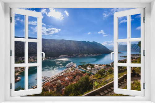 Fototapeta Naklejka Na Ścianę Okno 3D - Kotor Bay and Old Town panorama from above Kotor's castle of San Giovanni. Mountains, traditional house roofs and Boka Kotorska fjord wide angle view.