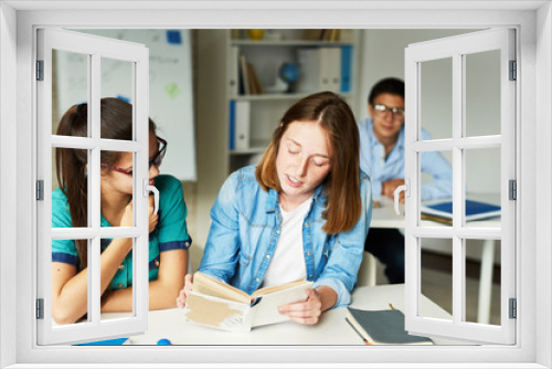 Girls Reading Book for Literature Class