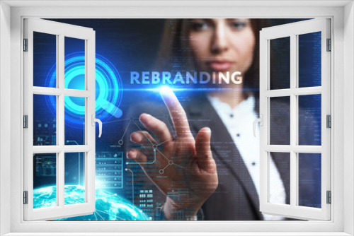 The concept of business, technology, the Internet and the network. A young entrepreneur working on a virtual screen of the future and sees the inscription: Rebranding