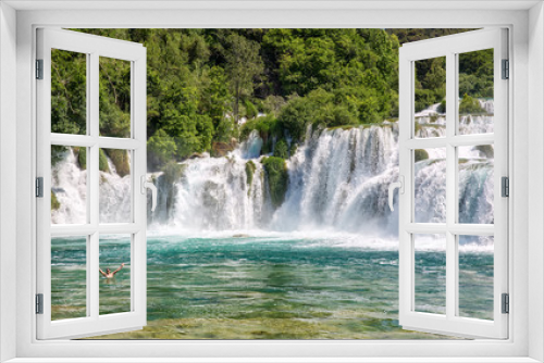 Fototapeta Naklejka Na Ścianę Okno 3D - Wasserfall mit badender Person im Naturparadies Krka