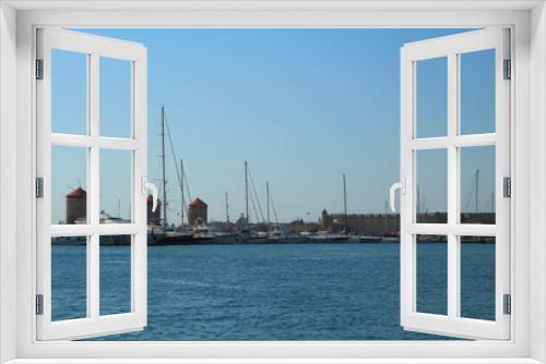 Fototapeta Naklejka Na Ścianę Okno 3D - Mandraki harbour in Rhodes, Greece