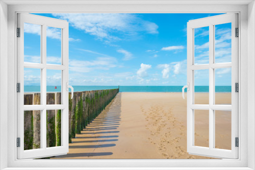 Fototapeta Naklejka Na Ścianę Okno 3D - Sandy beach along a sea in sunlight in summer