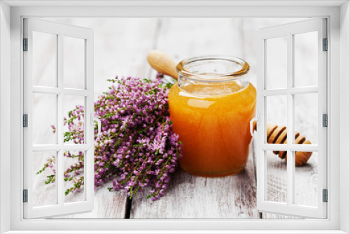 Fototapeta Naklejka Na Ścianę Okno 3D - Delicious fresh honey in pot or jar and flowers heather on wooden vintage background.