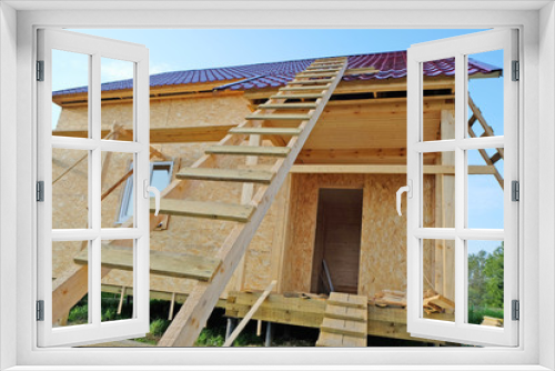 Fototapeta Naklejka Na Ścianę Okno 3D - construction of wooden frame-panel house