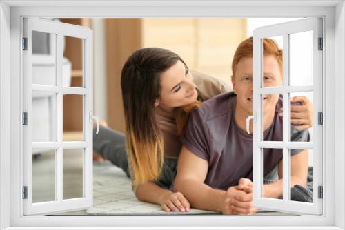 Happy young couple resting at home