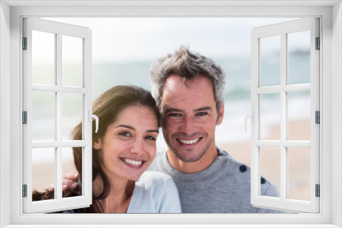 Portrait of a middle-aged couple having fun on the beach