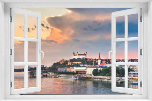Fototapeta Naklejka Na Ścianę Okno 3D - Cityscape of Bratislava, Slovakia at Sunset  as Seen from a Bridge over Danube River Towards Old Town of Bratislava.