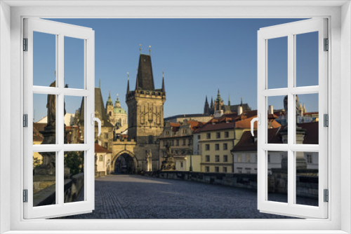 Fototapeta Naklejka Na Ścianę Okno 3D - Early morning at Charles Bridge in Prague. In distance is Saint Vitius Cathedral