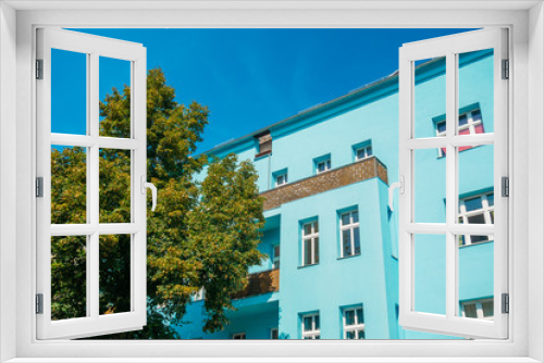 Fototapeta Naklejka Na Ścianę Okno 3D - high colored blue building with clean sky