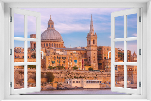 Fototapeta Naklejka Na Ścianę Okno 3D - Valletta Skyline with ship at beautiful sunset from Sliema with churches of Our Lady of Mount Carmel and St. Paul's Anglican Pro-Cathedral, Valletta, Capital city of Malta