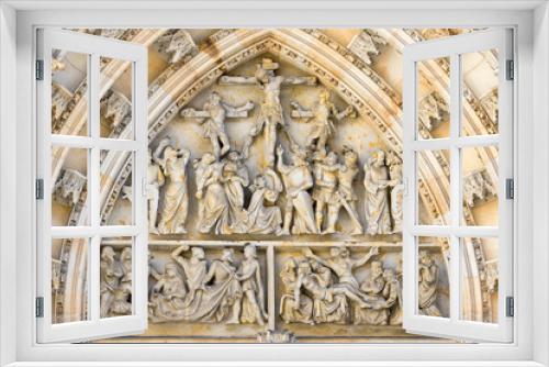 Prague, Czech Republic - August 19, 2017: Detail of white marble sculpture on the entrance door of the cathedral of San Vito