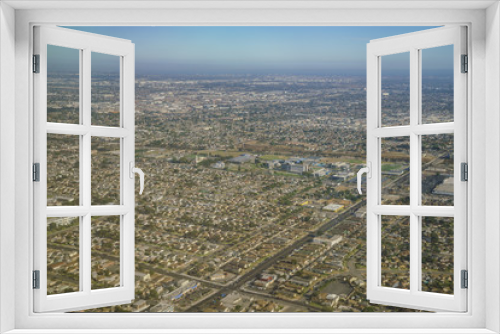 Fototapeta Naklejka Na Ścianę Okno 3D - Aerial view of cityscape, view from window seat in an airplane