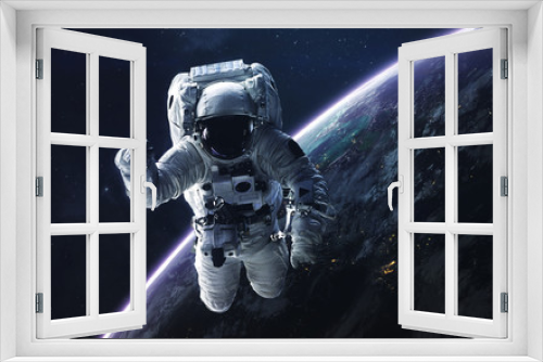 Fototapeta Naklejka Na Ścianę Okno 3D - Astronaut. Abstract space wallpaper. Universe filled with stars, nebulas, galaxies and planets. Elements of this image furnished by NASA