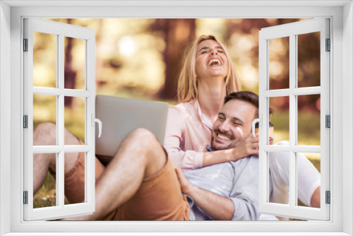 Couple in love using a tablet in nature