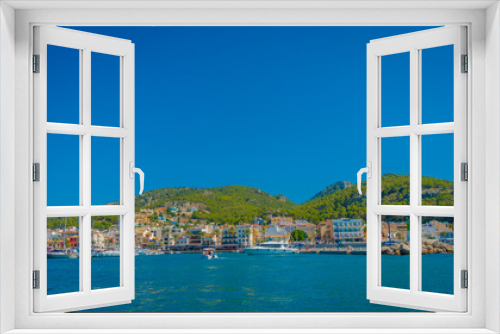 Fototapeta Naklejka Na Ścianę Okno 3D - Beautiful view of Mallorca balearic islands, with some buildings in the mountain in the horizon, with gorgeous blue water and a beautiful blue sky, in Spain