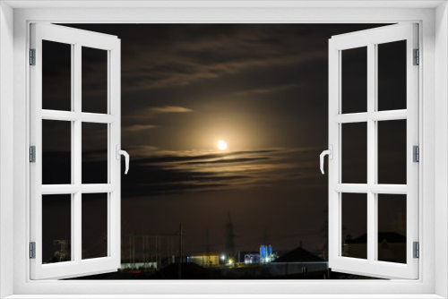 Fototapeta Naklejka Na Ścianę Okno 3D - Moon, clouds over the village