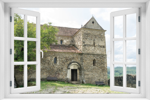 Fototapeta Naklejka Na Ścianę Okno 3D - Cisnadioara, Transylvania, Romania. Fortified medieval church on top of rock hill in Cisnadioara near Sibiu, Transylvania, Romania. Cloudy summer day.