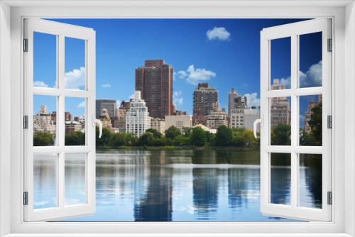 New York skyline reflected in Central Park lake in summer time