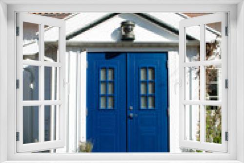 Fototapeta Naklejka Na Ścianę Okno 3D - Beautiful vintage white wood house and blue doors in scandinavian style.