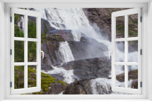 Fototapeta Naklejka Na Ścianę Okno 3D - Summer mountain Langfossen waterfall on slope (Etne, Norway).