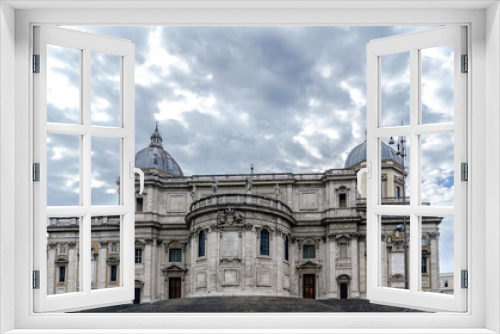 Fototapeta Naklejka Na Ścianę Okno 3D - Facade of the papal Basilica called Santa Maria Maggiore, without people in sight and with a blue sky with very light clouds. In the square called 