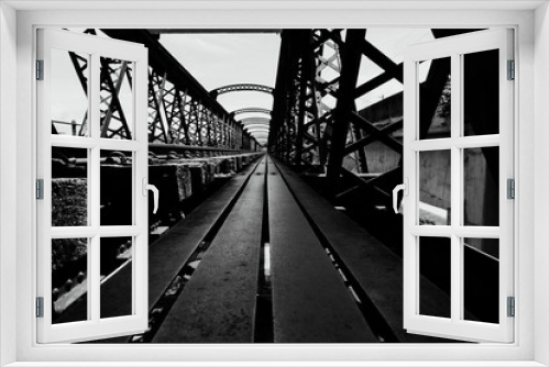 Fototapeta Naklejka Na Ścianę Okno 3D - Black and white image, perspective view of old railway bridge