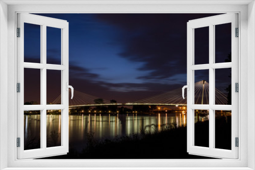 Fototapeta Naklejka Na Ścianę Okno 3D - Beleuchtete Passerelle des deux Rives, Brücke der zwei Ufer bei Nacht