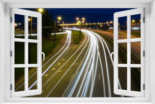 Fototapeta Naklejka Na Ścianę Okno 3D - Light trails from cars in Riga city. Long exposure photograph at night