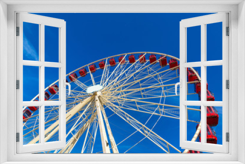 Fototapeta Naklejka Na Ścianę Okno 3D - Ferris wheel on blue sky