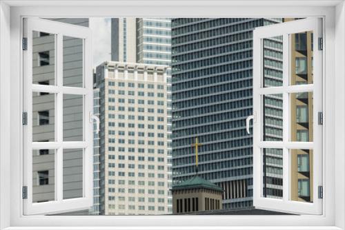 Fototapeta Naklejka Na Ścianę Okno 3D - Kirchturm der Matthäusgemeinde und Hochhausfassaden