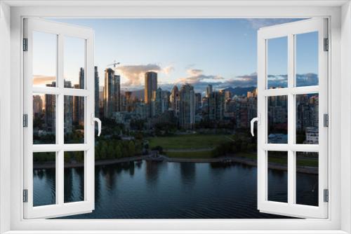 Aerial Panorama of Downtown City at False Creek, Vancouver, British Columbia, Canada. Taken during a bright sunset.